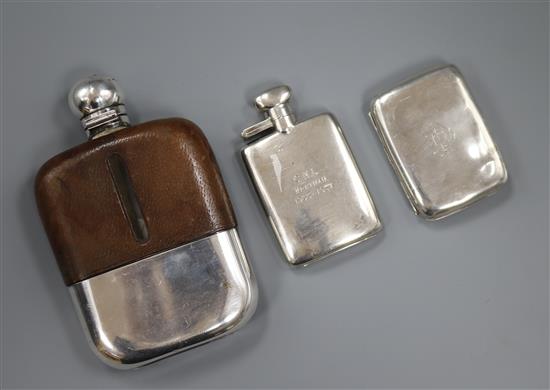 A small silver hip flask, a leather and plate-mounted hip flask and a silver cigarette case